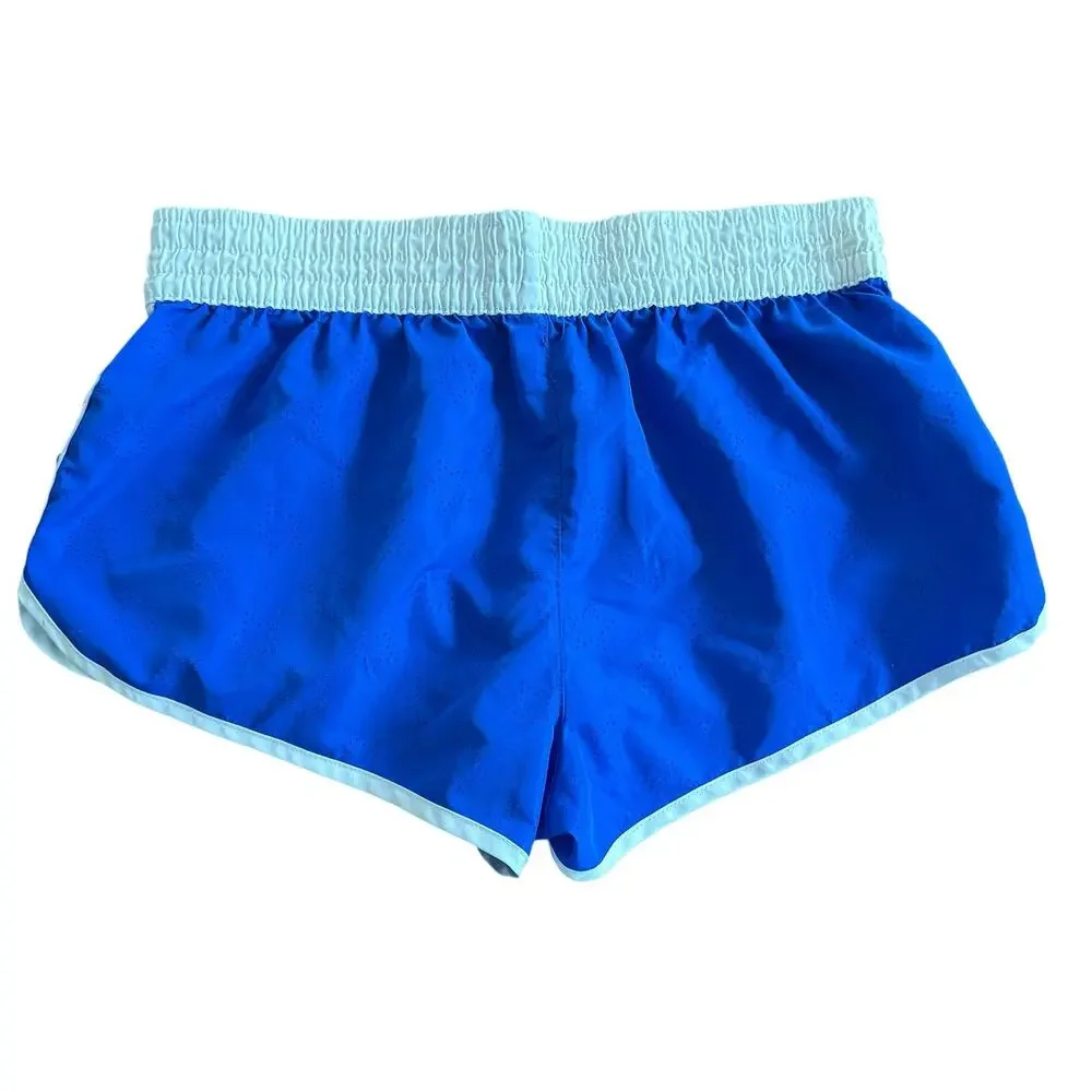 OP Girl’s cobalt blue athletic shorts, star die-cut pattern and white trim, M